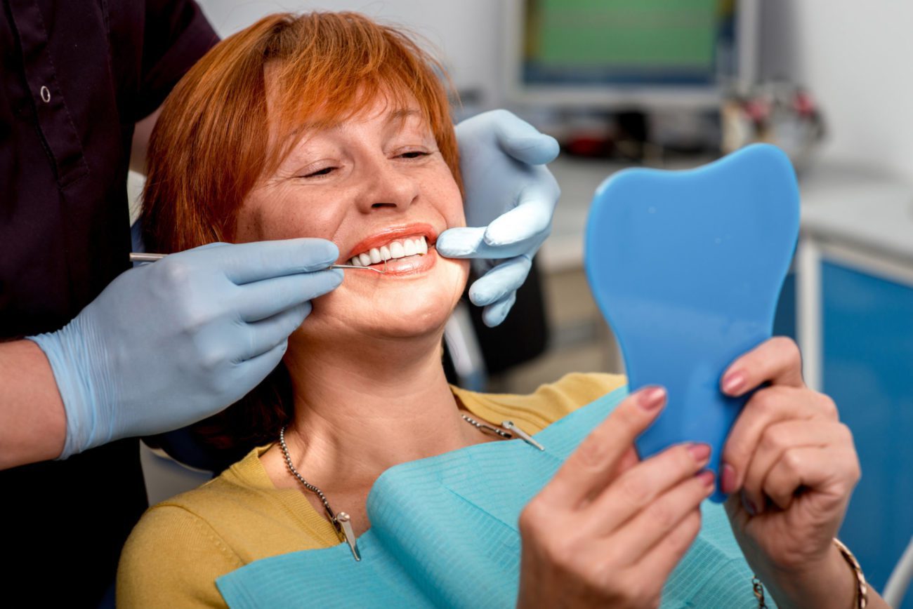 woman visiting the dentist periodontal screening new orleans la
