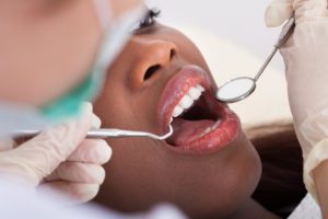 Patient Being Examined By Dentist